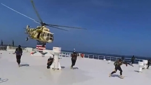 Houthi fighters land on the deck of the Galaxy Leader in a choreographed boarding operation (Houthi Military Media)