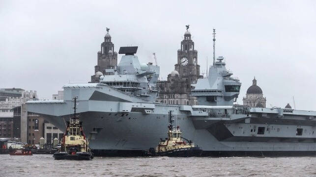 Prince of Wales aircraft carrier with tugs